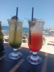 A long island ice tea on the left and a Singapore slingshot cocktail on the right