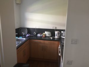 Kitchen with microwave, kettle, toaster and cooker