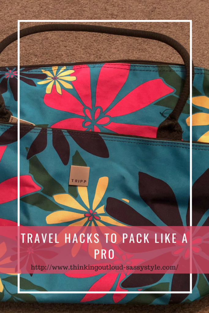 A blue bag with pink and yellow flowers text reads "19 Travel hacks to pack like a pro"