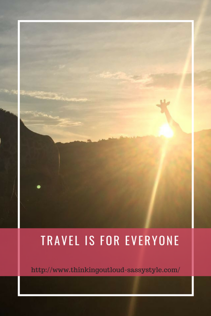 Looking towards the sun as it sets, two giraffes are sillohetted against it, with one to the left of the picture and one just in front of the sun to the right with hte text "Travel is for everyone"