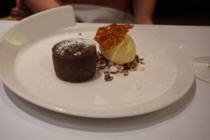 A chocolate melt in the middle pudding, with a scoop of icecream