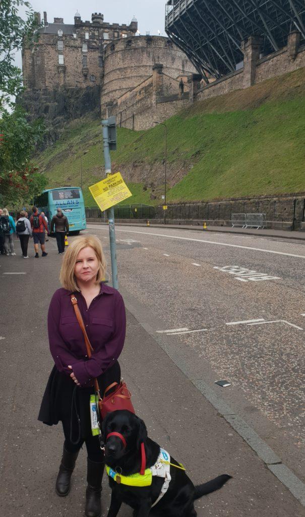 Sassy and ida standing on the street with Edinburgh castle in the background