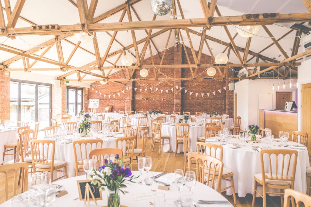The Red Brick barn decorated for a wedding breakfast