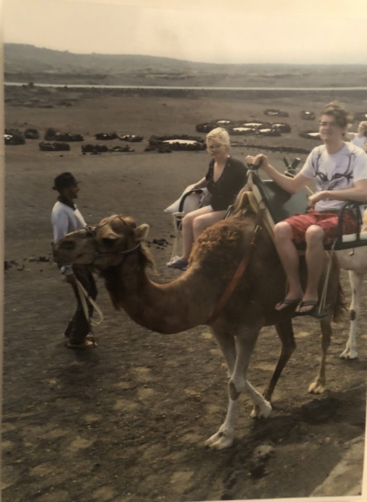 Sassy and Grant Sitting on and riding a camel