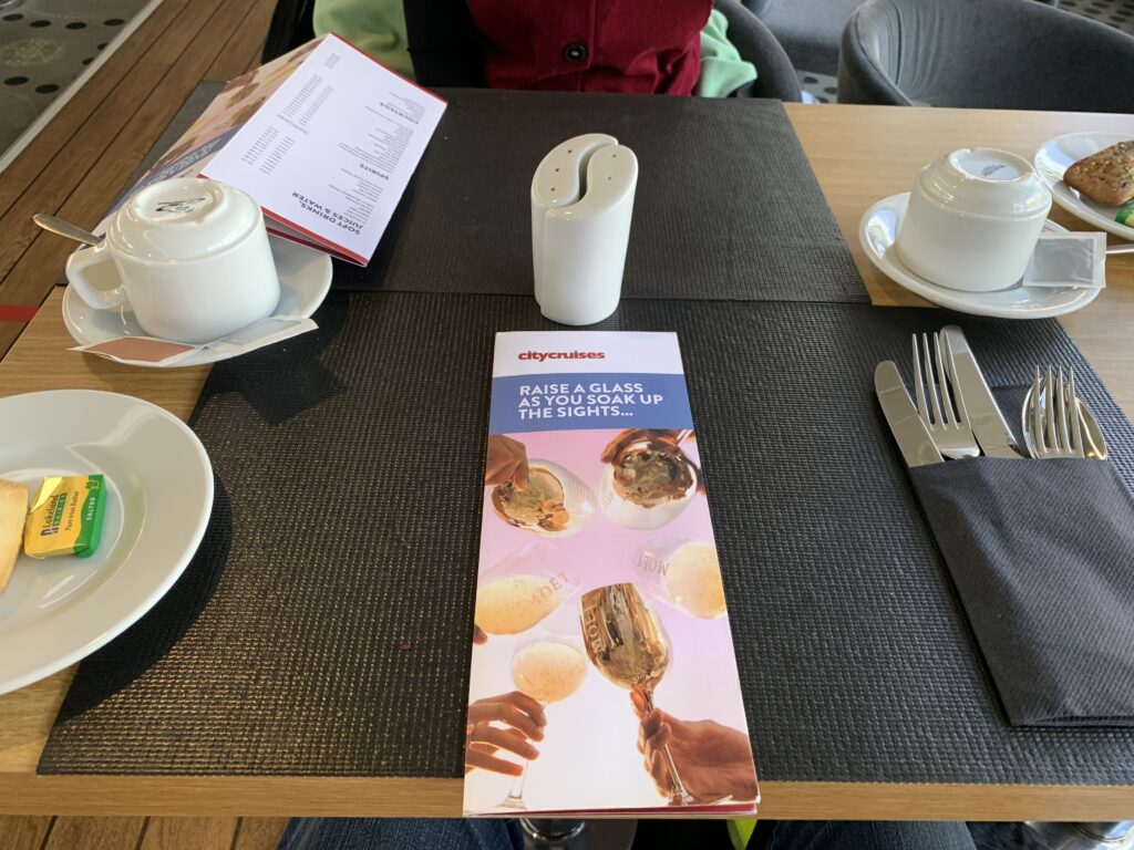 City Cruise menu with salt and pepper shakers and tea cups all laid out on the table.